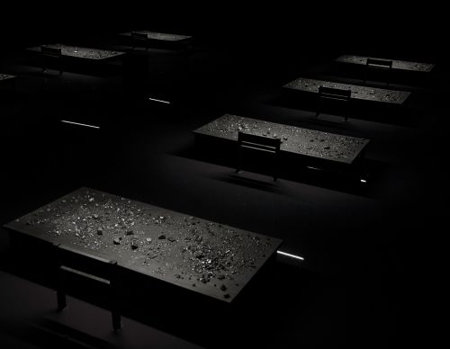 Installation, 11m x 10m, 8 desks, pigmented water, coal, 2016
